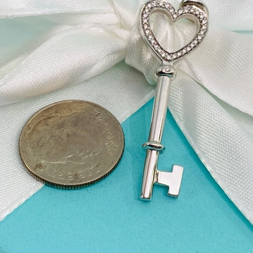 Tiffany & Co. Diamond Heart Key Charm 18kwg 1.5” – 0.10 CTW Diamonds